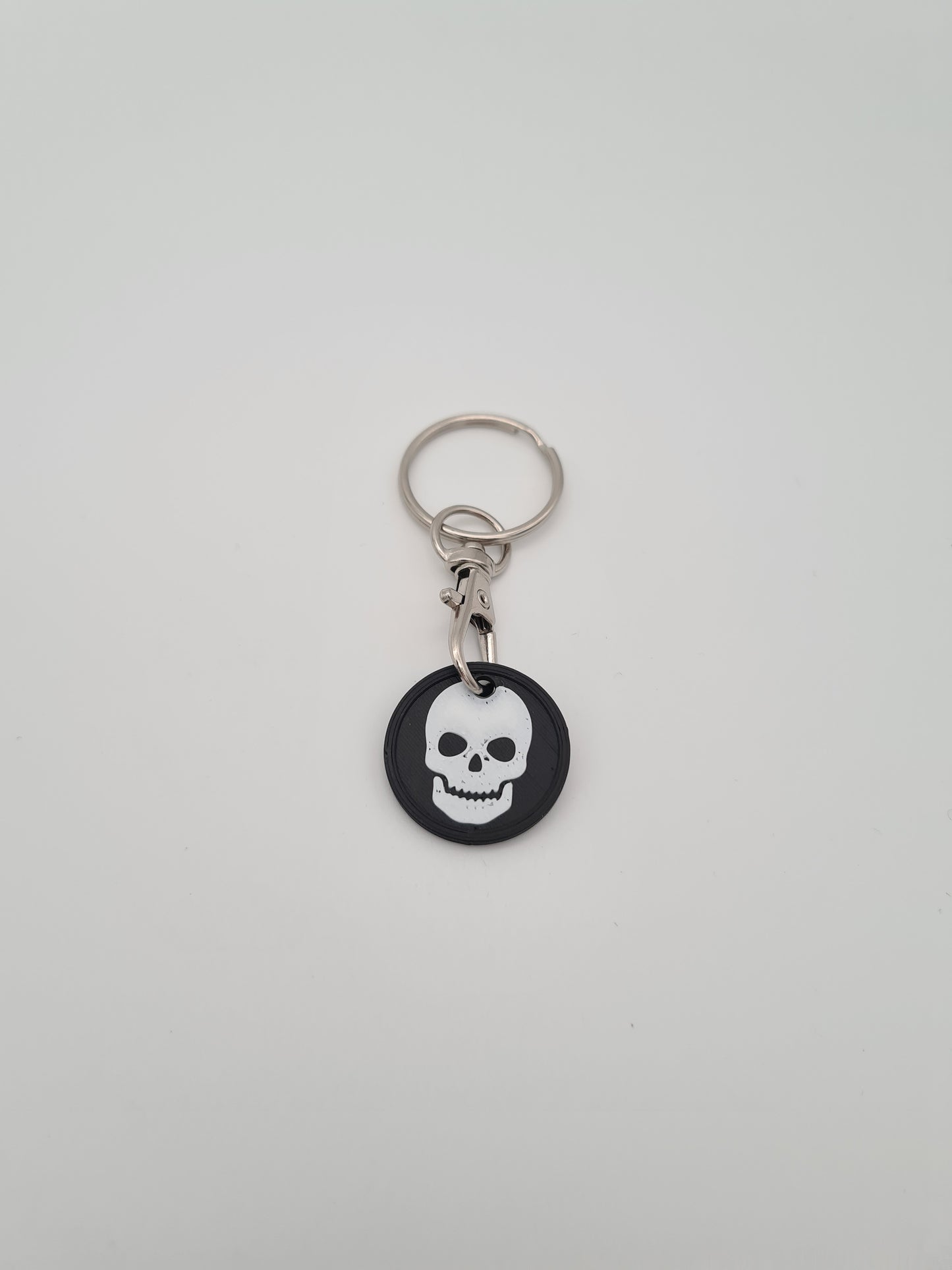 Schlüsselanhänger Einkaufwagenchip mit Totenkopf Symbol